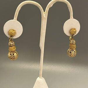 Pair of vintage, Cathe’ Clip on Earrings. Stylish gold tone metal, 1 3/8” long